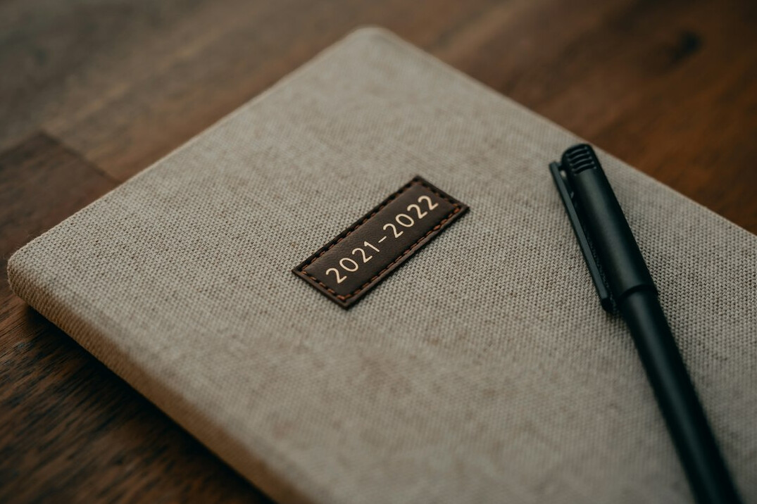 writer at desk with notebook